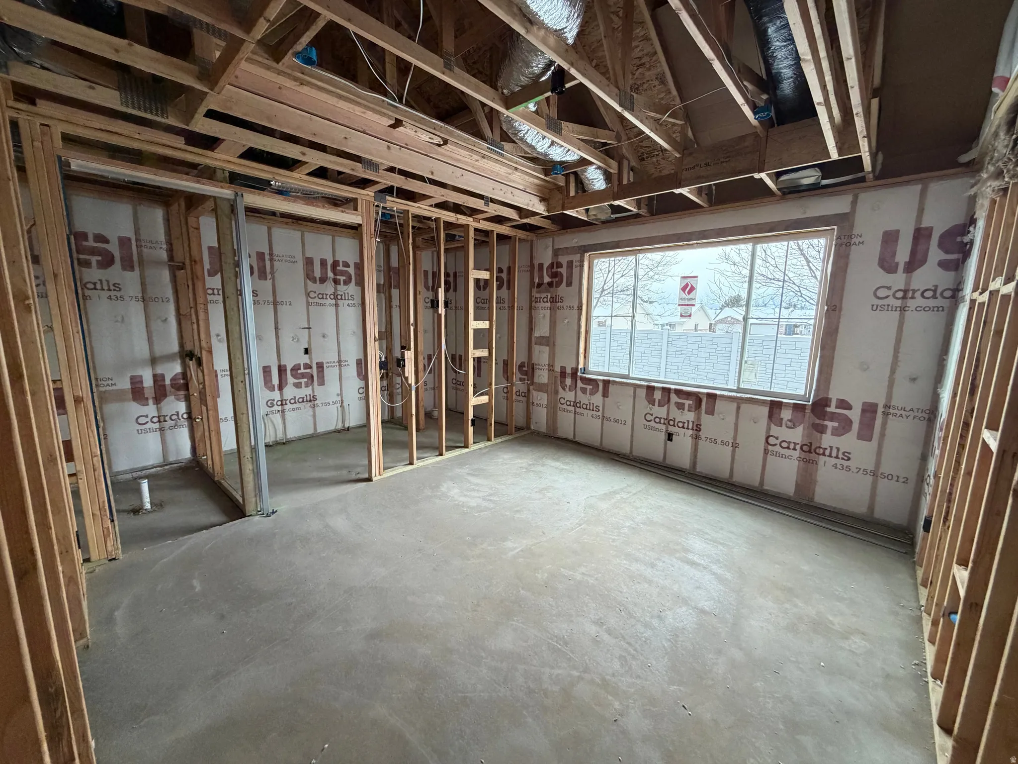 Misc room featuring unfinished concrete floors