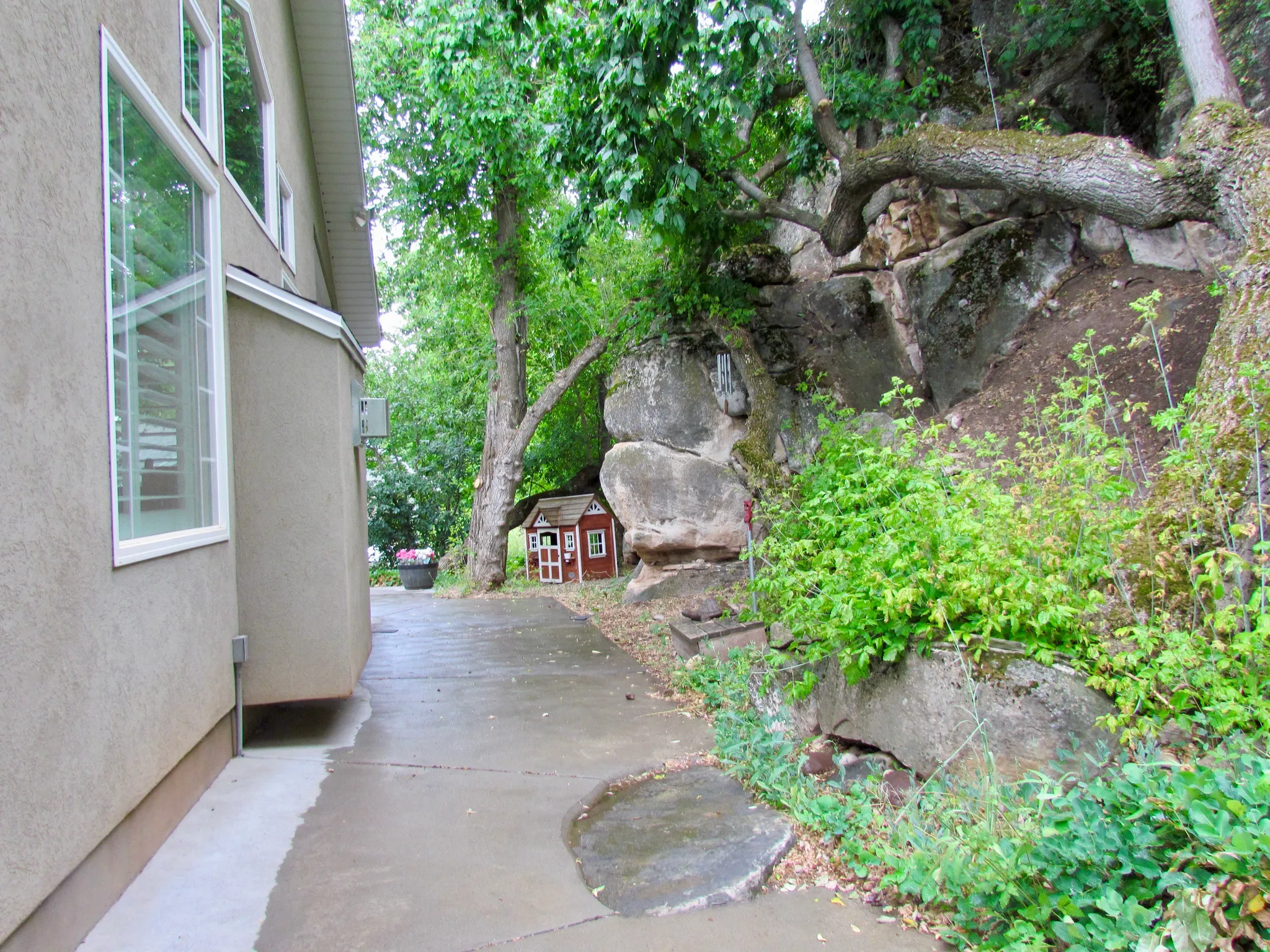 View of patio with a storage unit