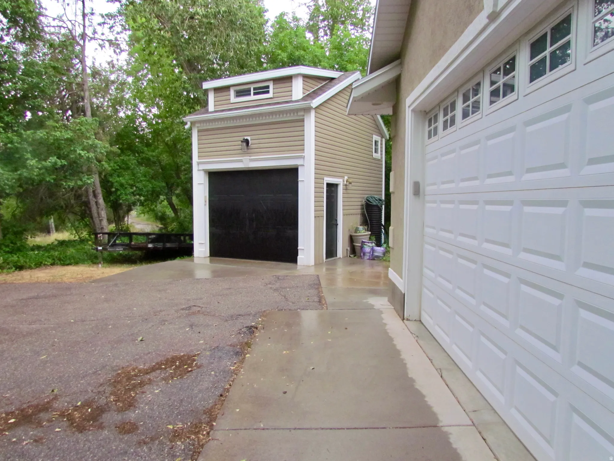 Garage featuring driveway