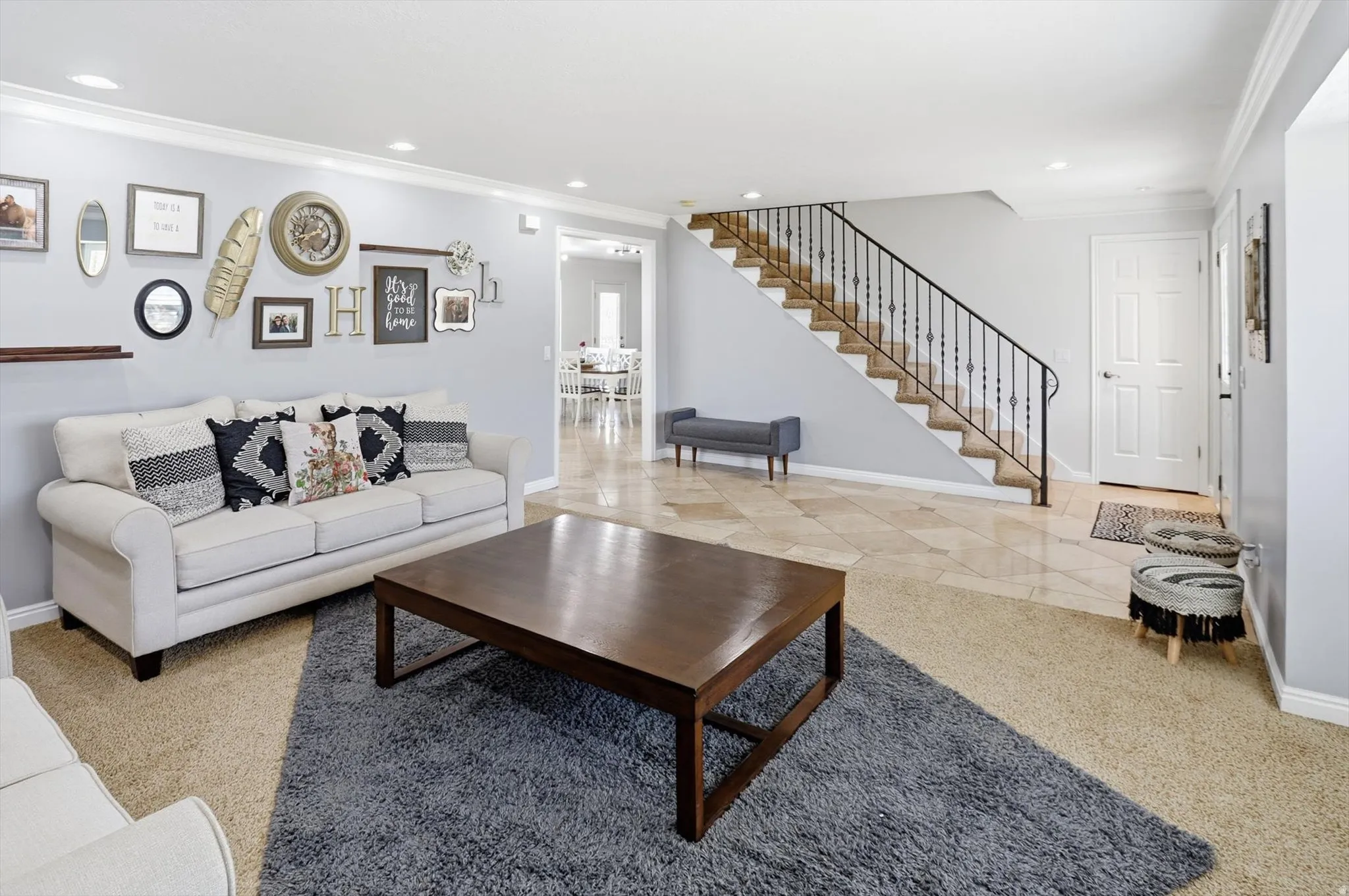 Living room featuring crown molding and recessed lighting