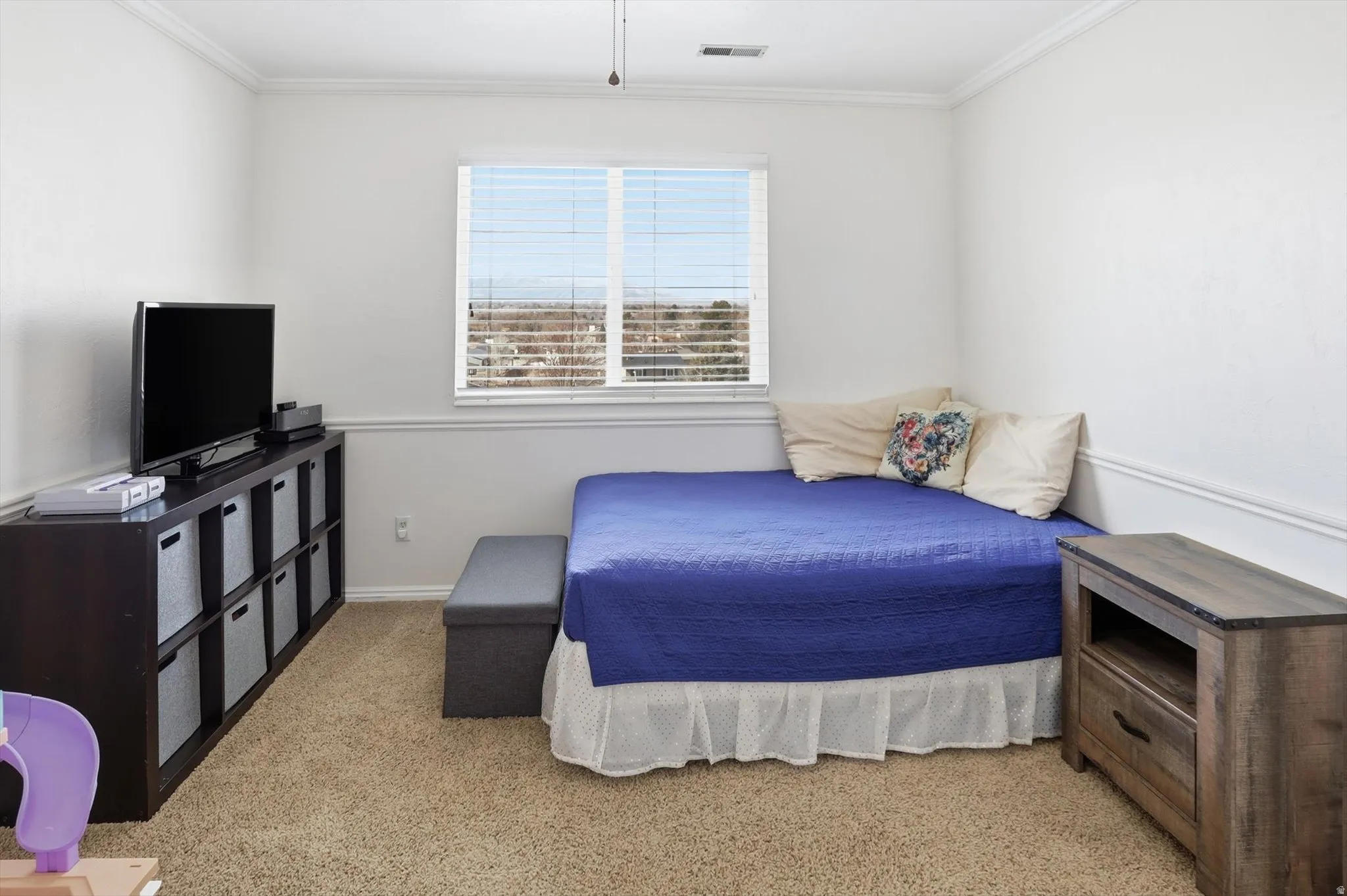 Bedroom featuring crown molding, light carpet, and ceiling fan