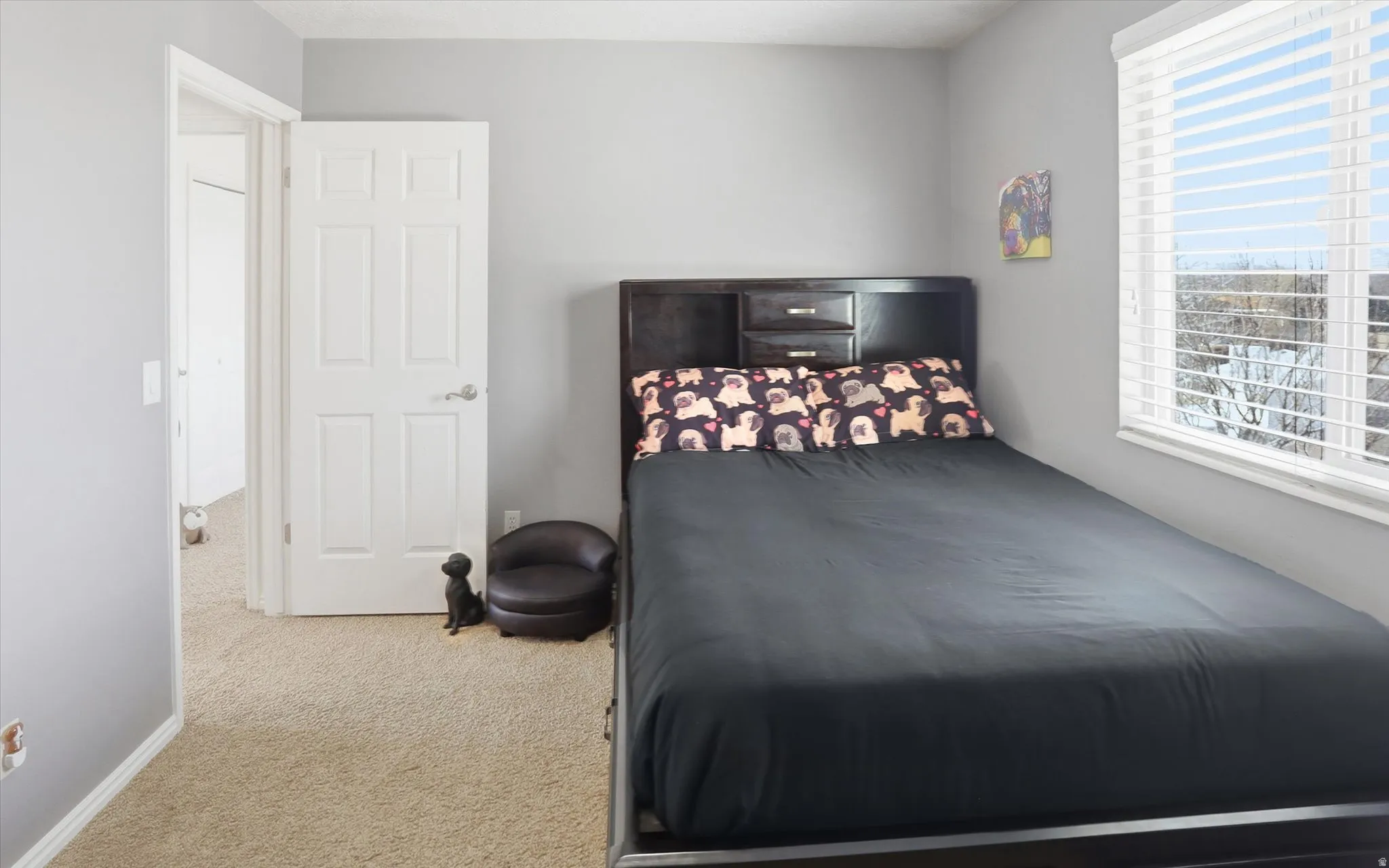 Bedroom with carpet floors and baseboards