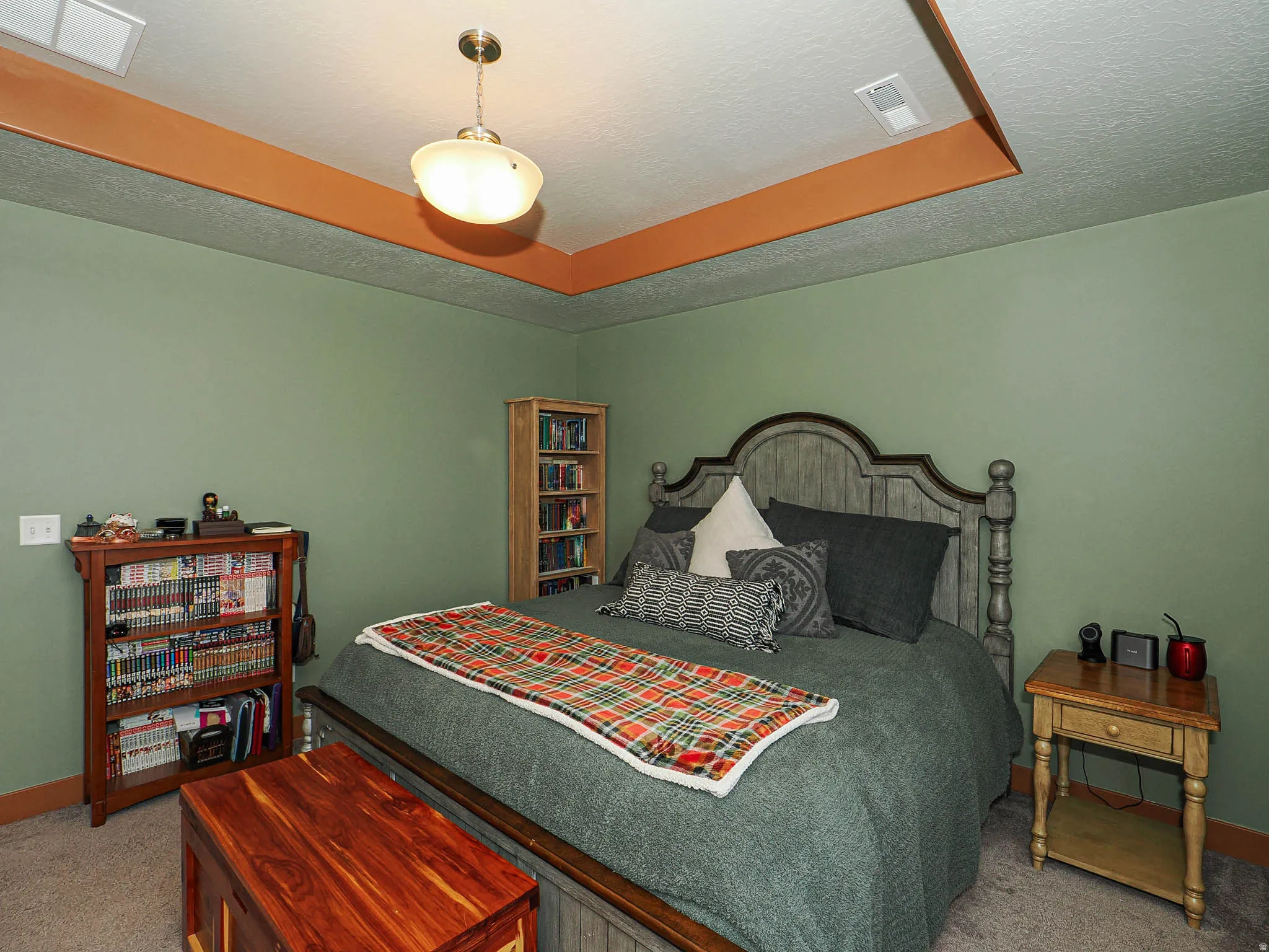 Carpeted bedroom featuring a textured ceiling