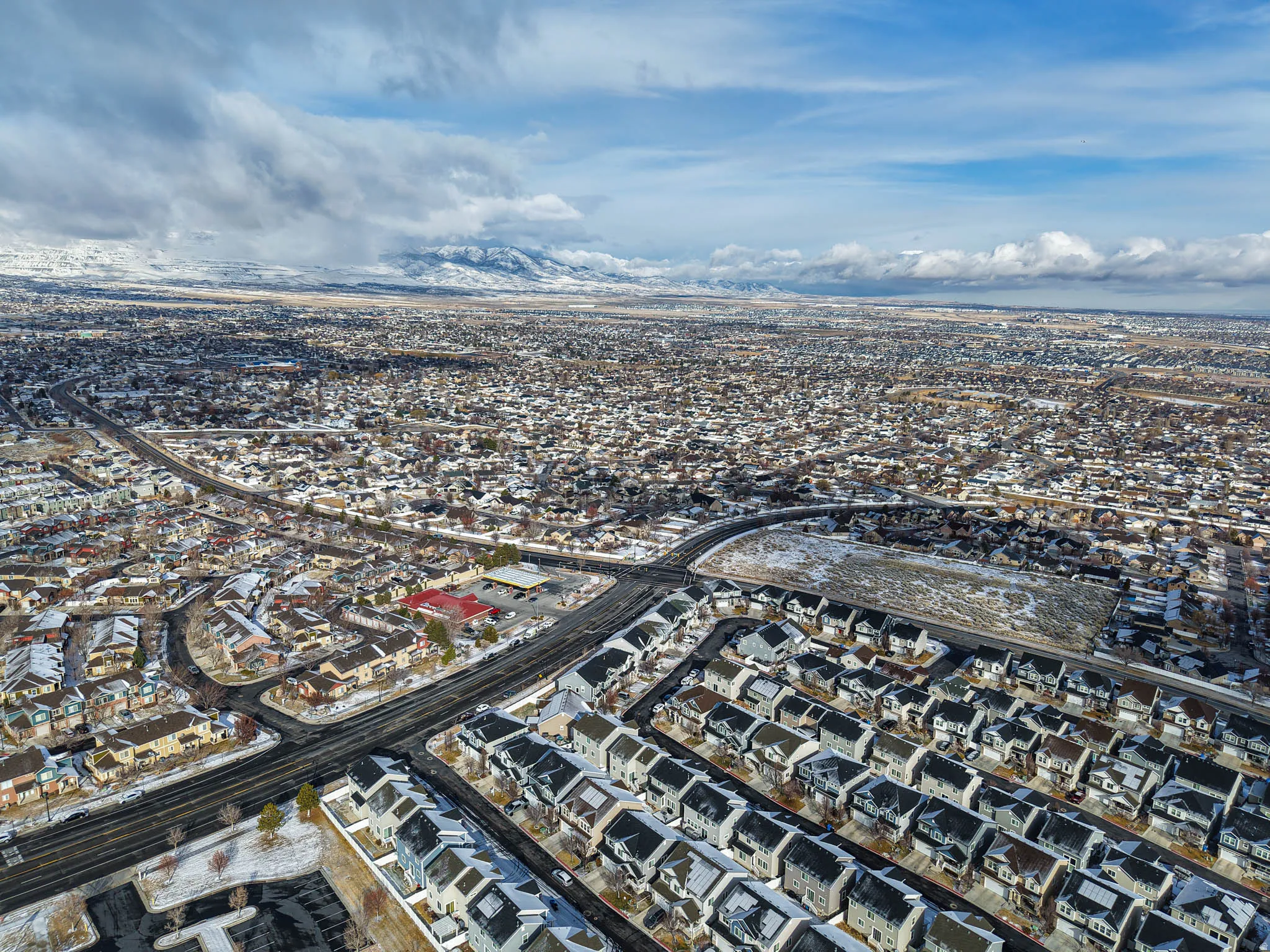 Aerial view of property's location with nearby suburban area