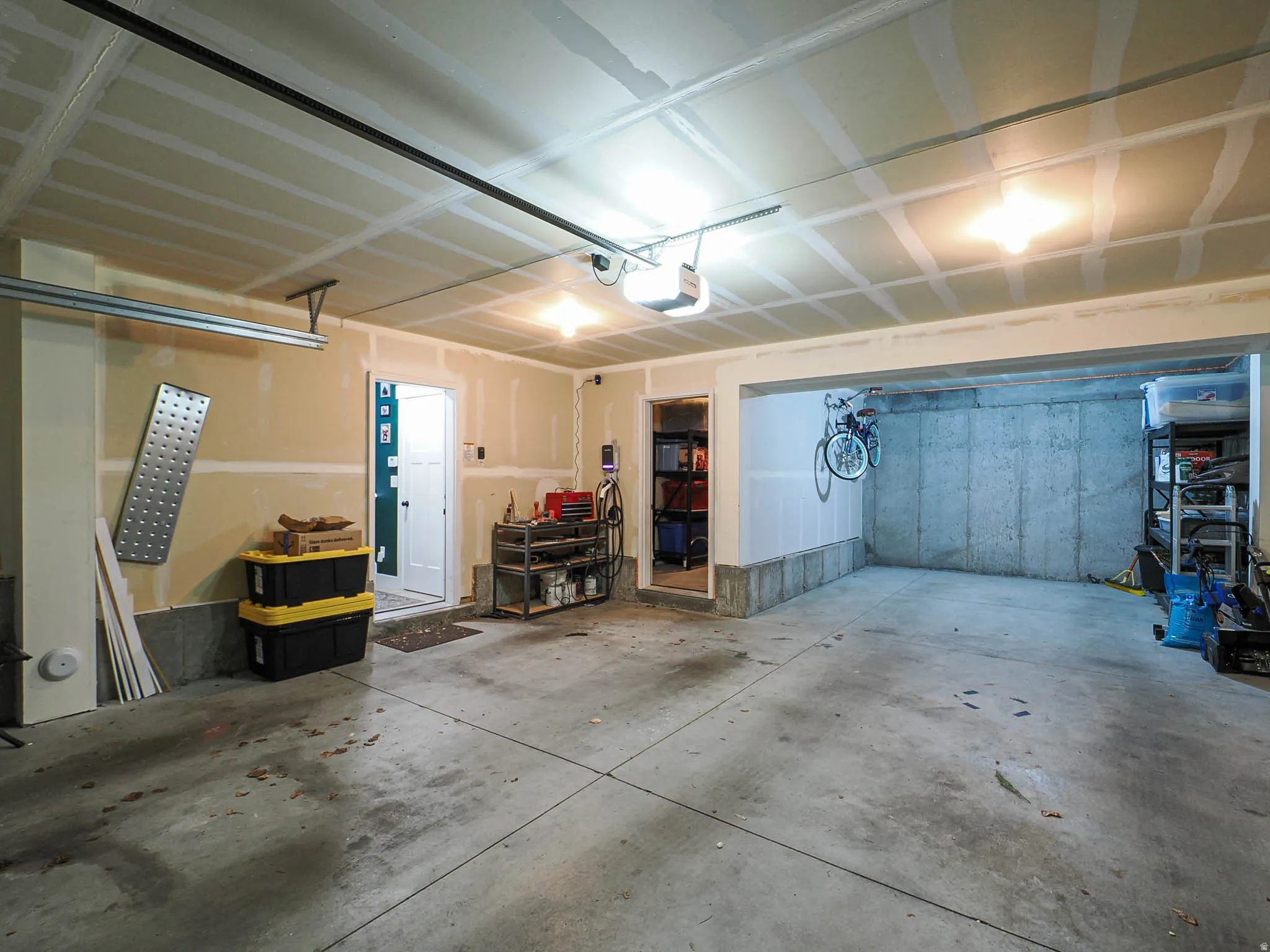 Garage featuring a garage door opener