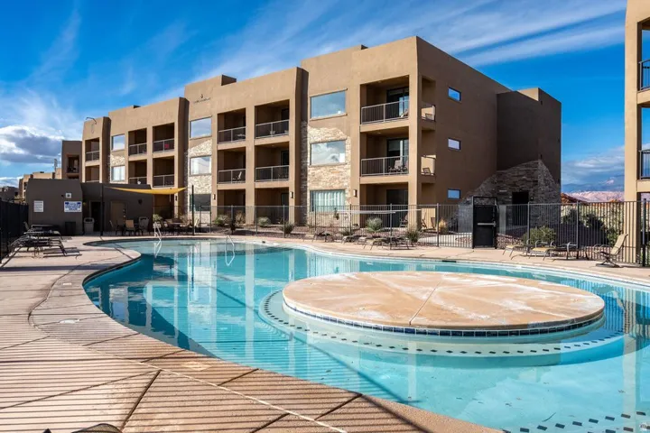Community pool featuring a patio area