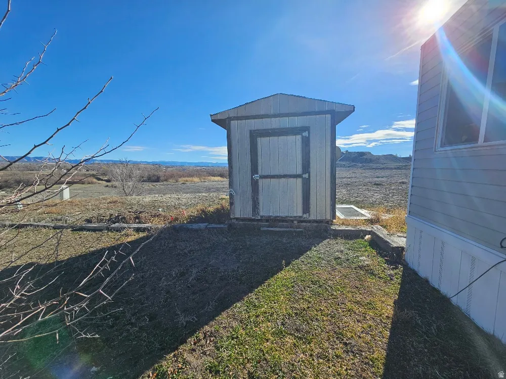 View of shed with a mountain view