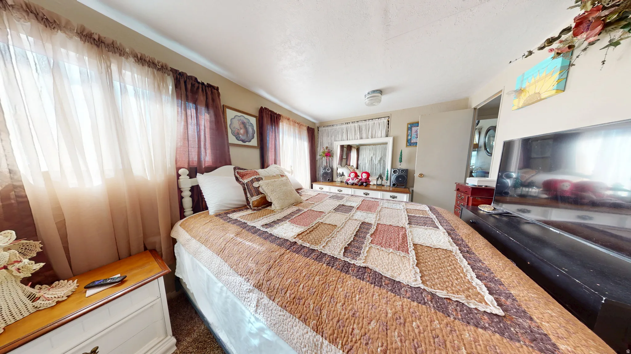 Bedroom featuring dark colored carpet
