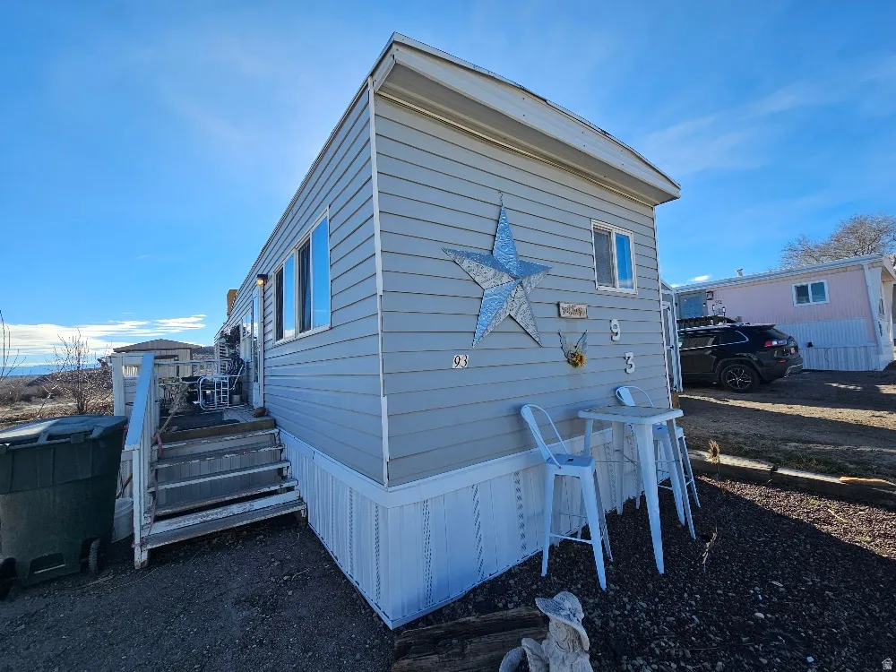 View of home's exterior with a deck