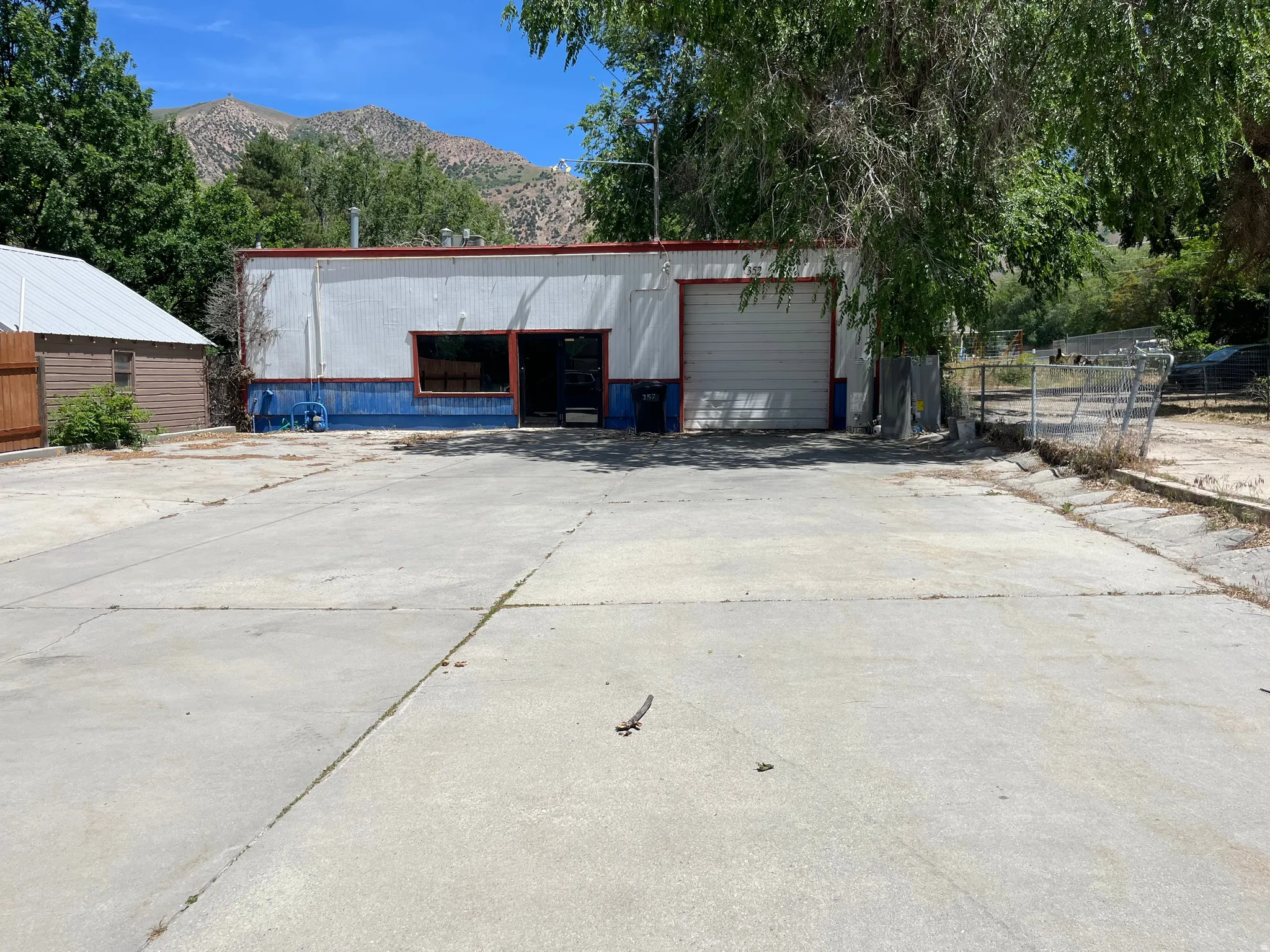 Building front with large parking lot