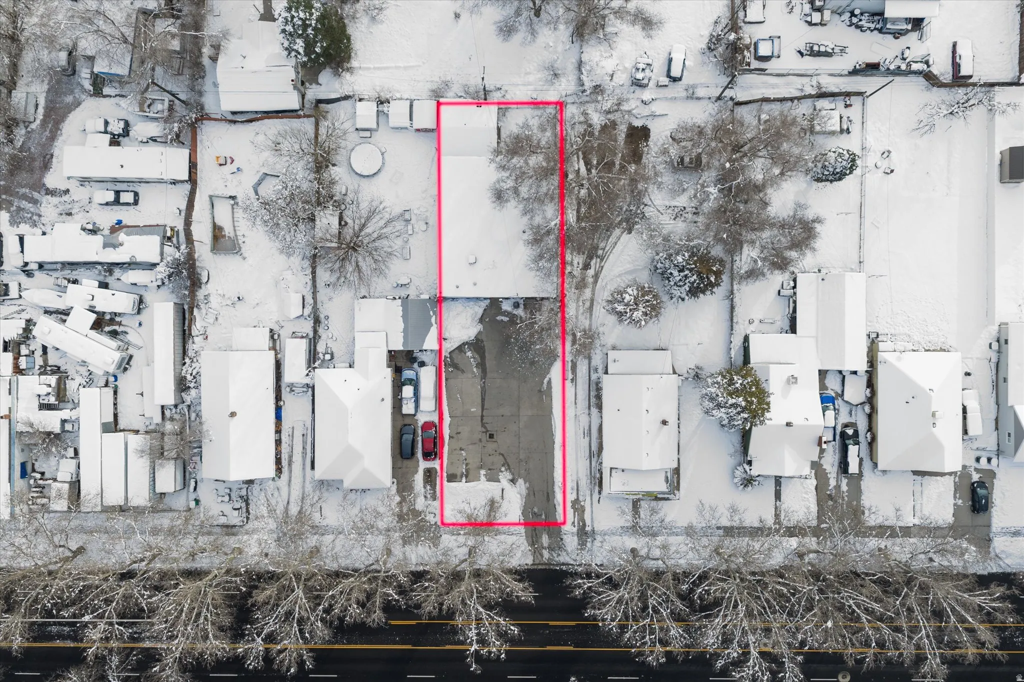 Aerial view of property and surrounding area featuring property boundaries highlighted