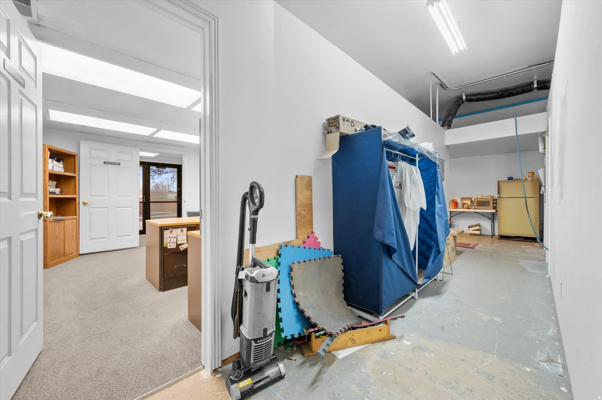 Hallway connecting office #1 to storage rooms and kitchen areas