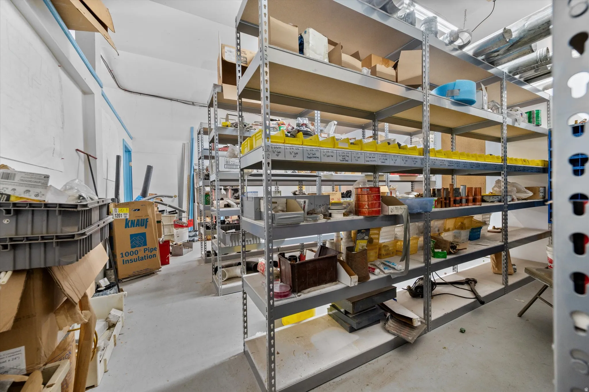 View of large storage/supply area with shelving