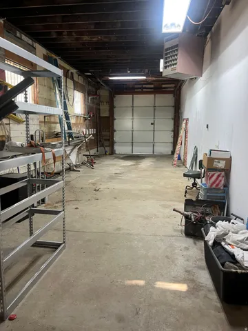 Concrete flooring,, extra length garage, ample storage