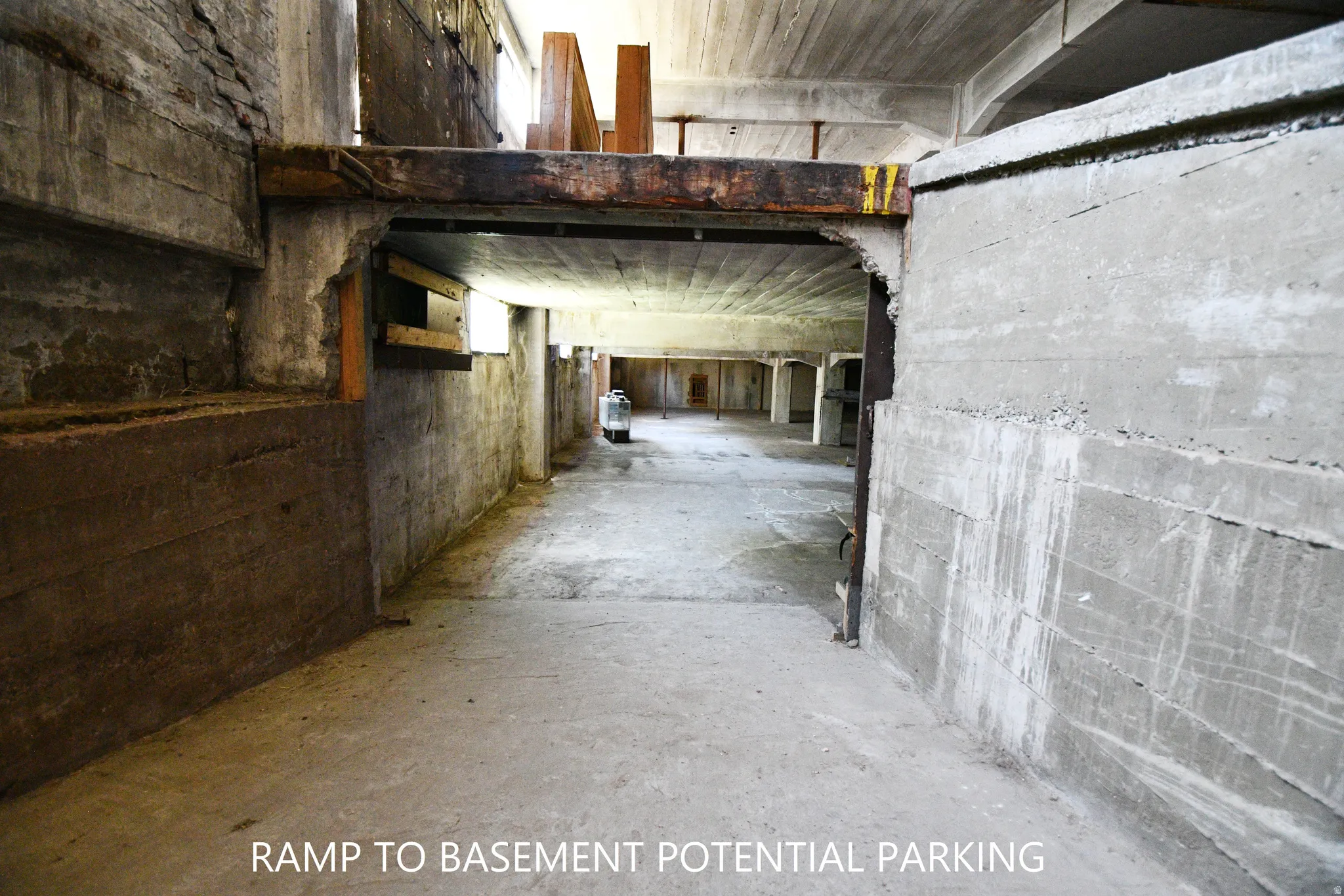 Misc room with unfinished concrete flooring