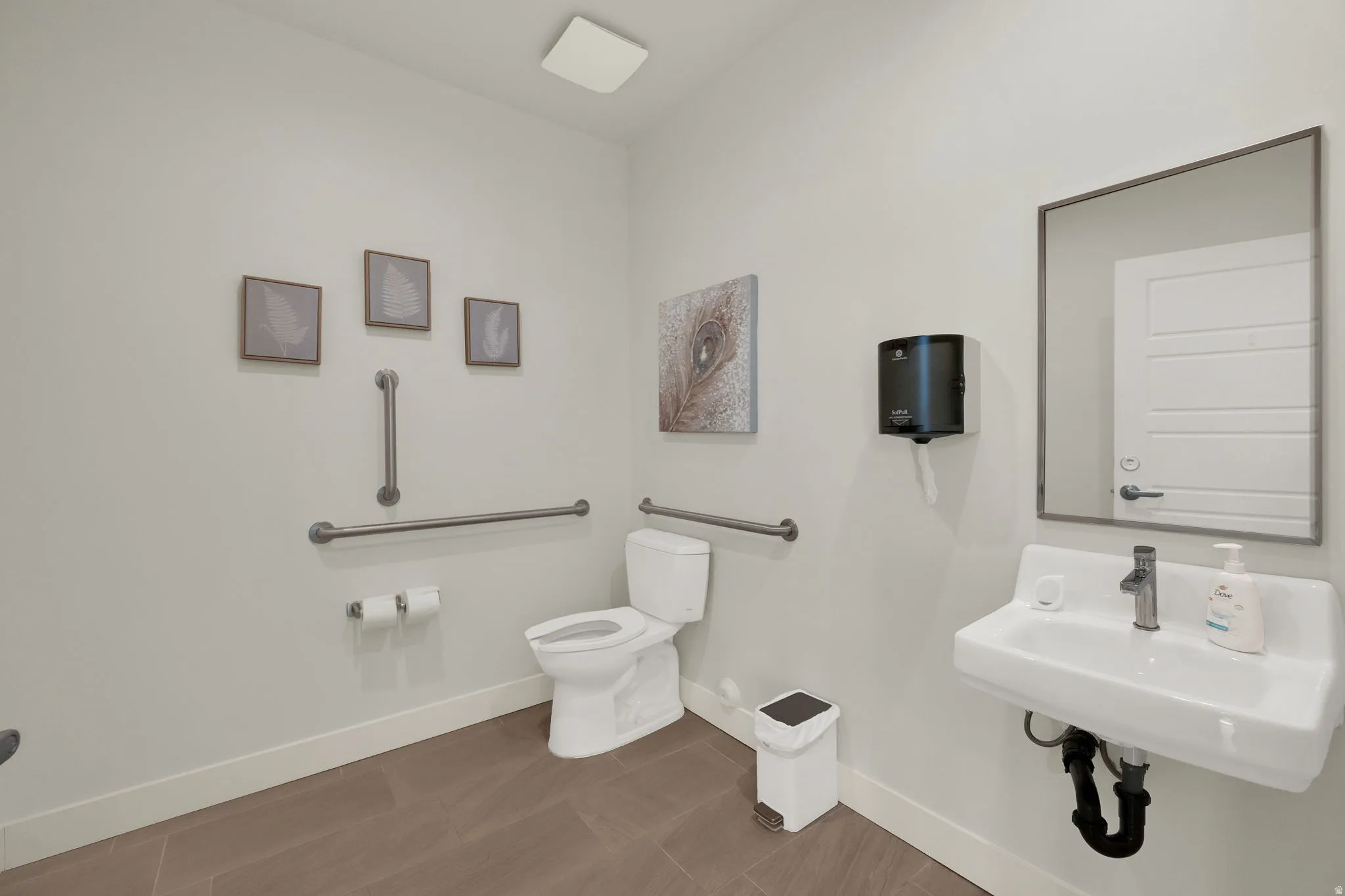 Bathroom featuring toilet and baseboards
