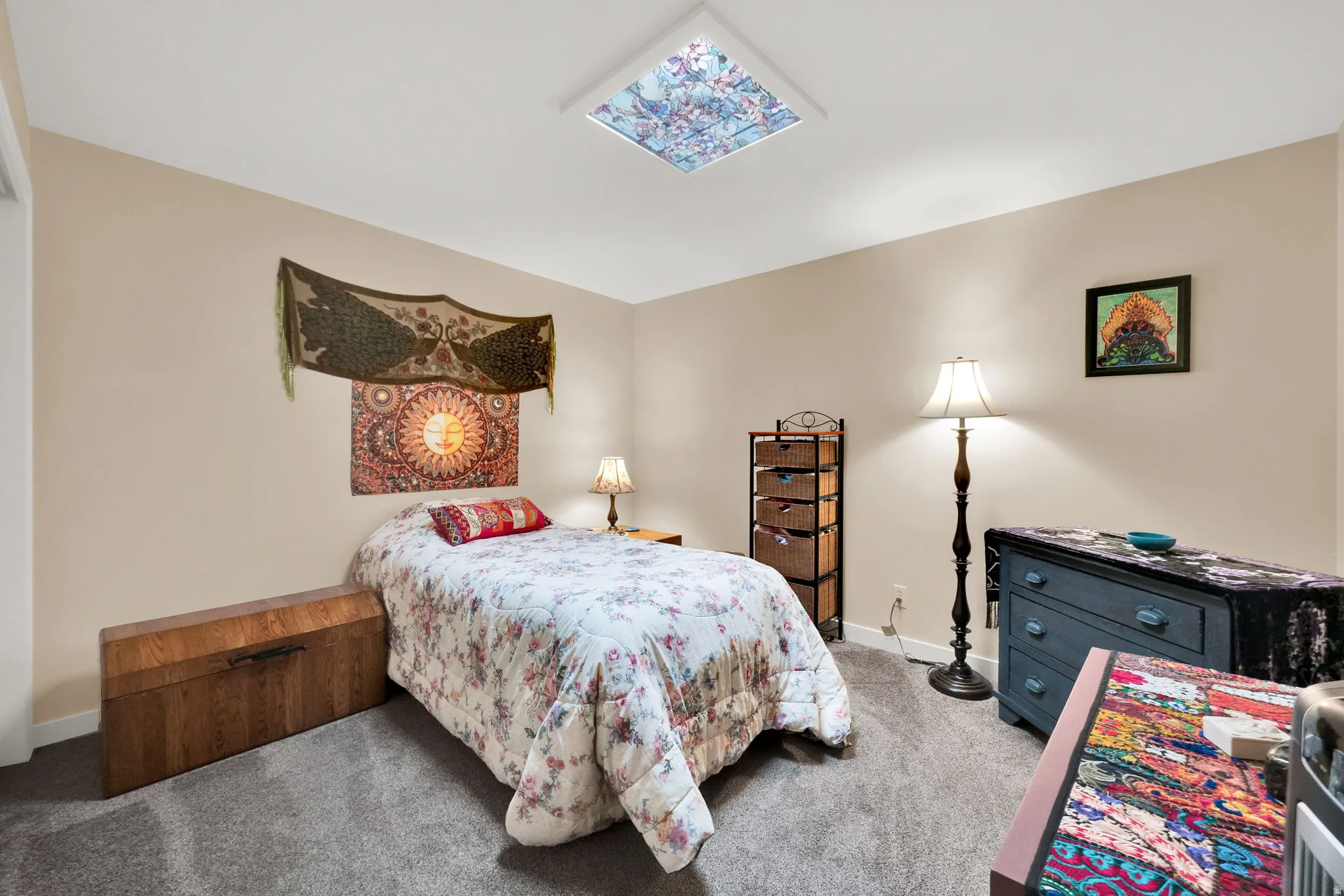 Carpeted bedroom with baseboards