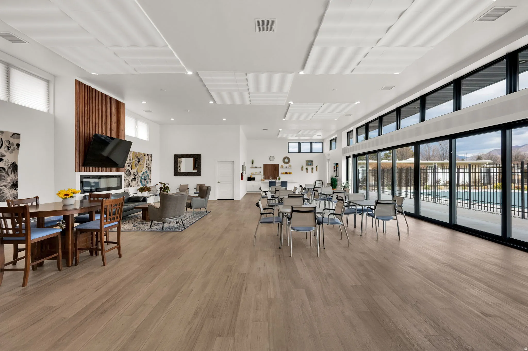 Dining room featuring a high ceiling and light wood-style flooring