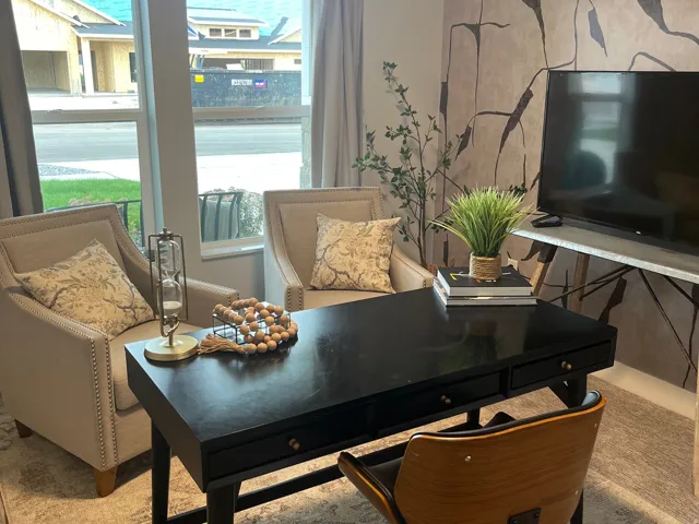 Office area featuring an accent wall