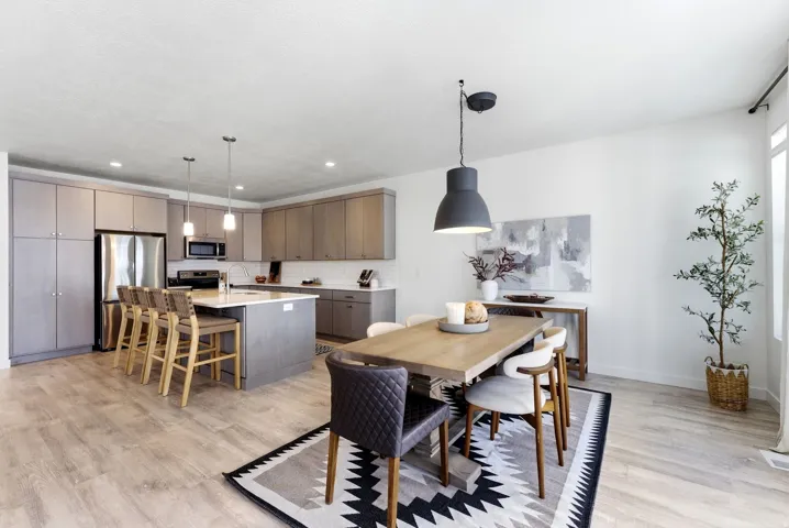 Dining space featuring light wood-type flooring and recessed lighting