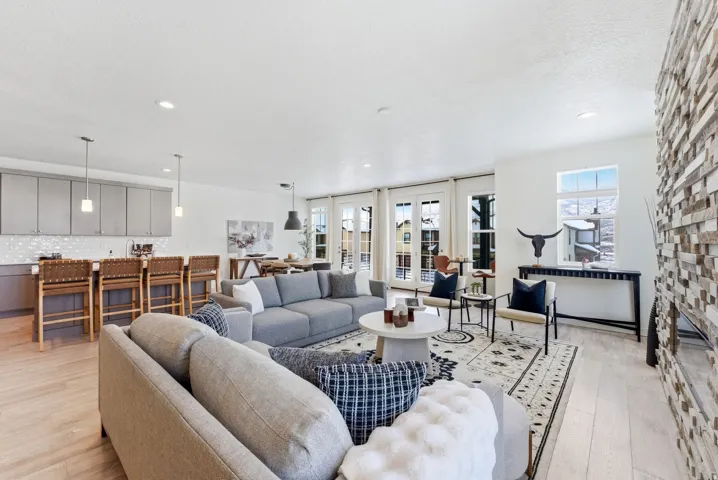 Living area featuring light wood-style floors and recessed lighting