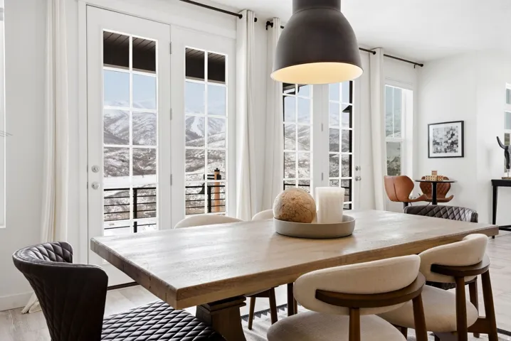 Dining room featuring light wood-style floors and a mountain view
