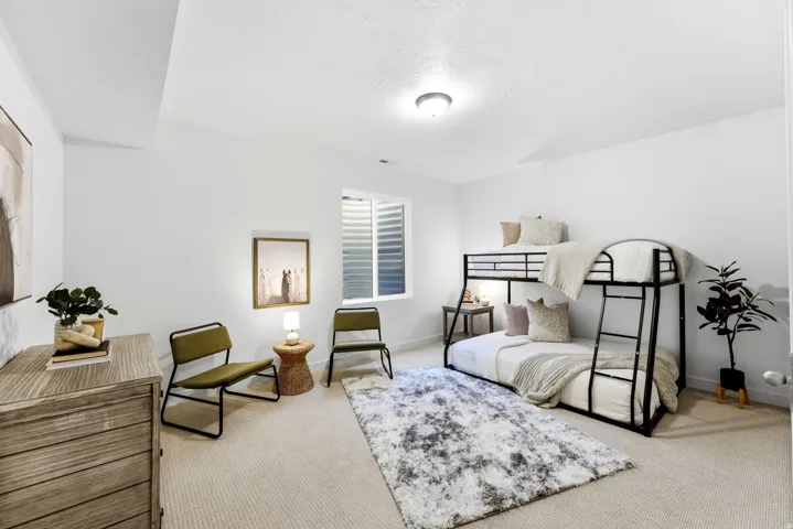 Bedroom with carpet and a textured ceiling