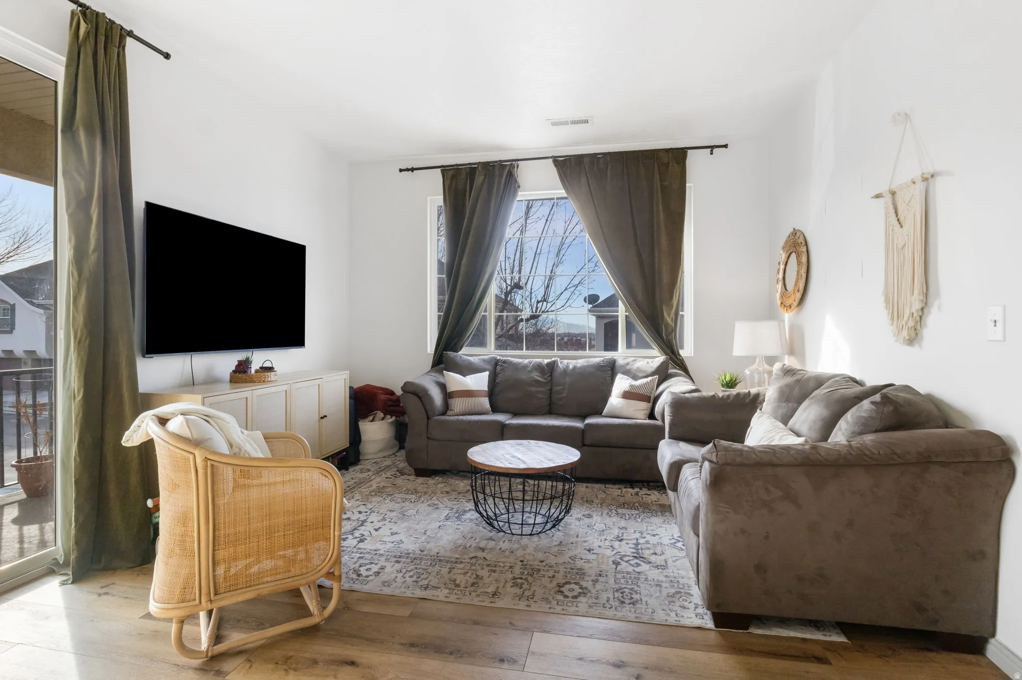 Living room with hardwood / wood-style flooring