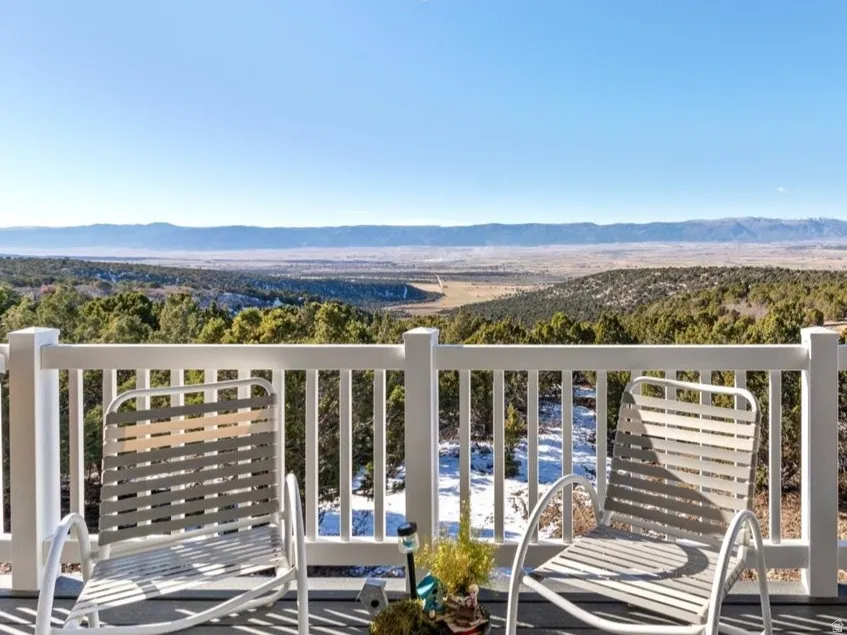 Balcony with a mountain view and a view of trees