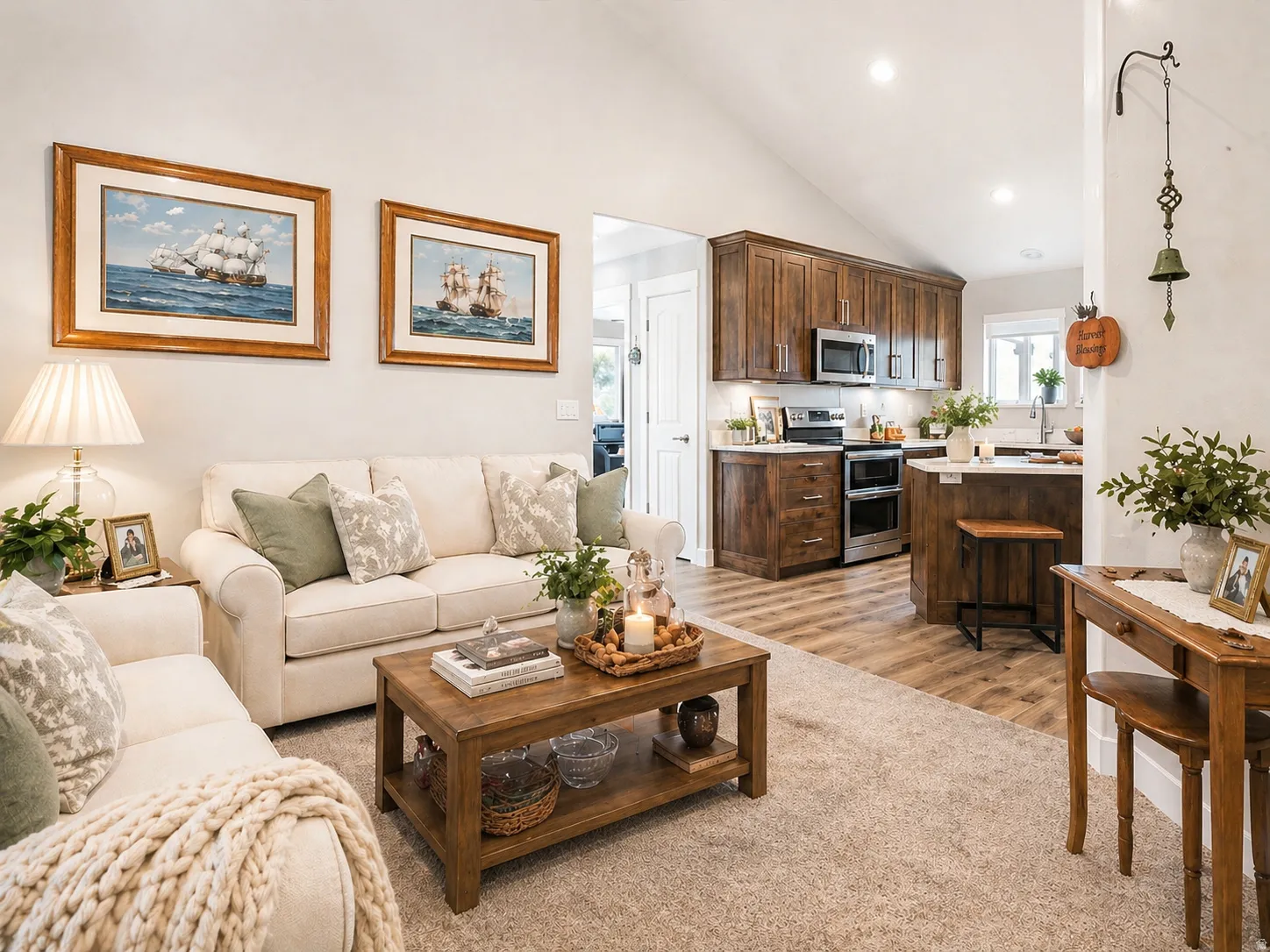 Living area featuring lofted ceiling, light wood-style flooring, and recessed lighting