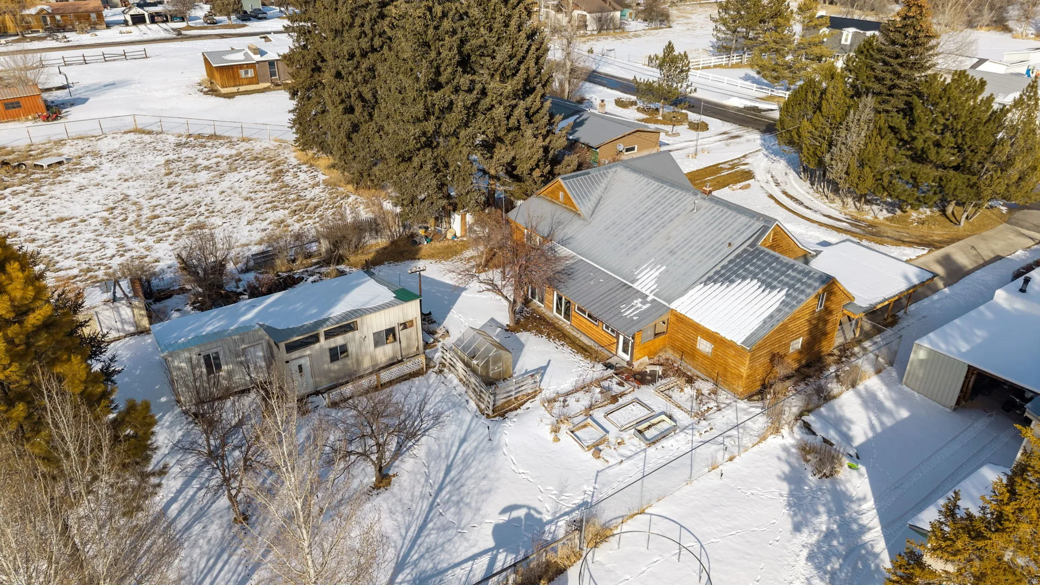 Snowy aerial view with a residential view