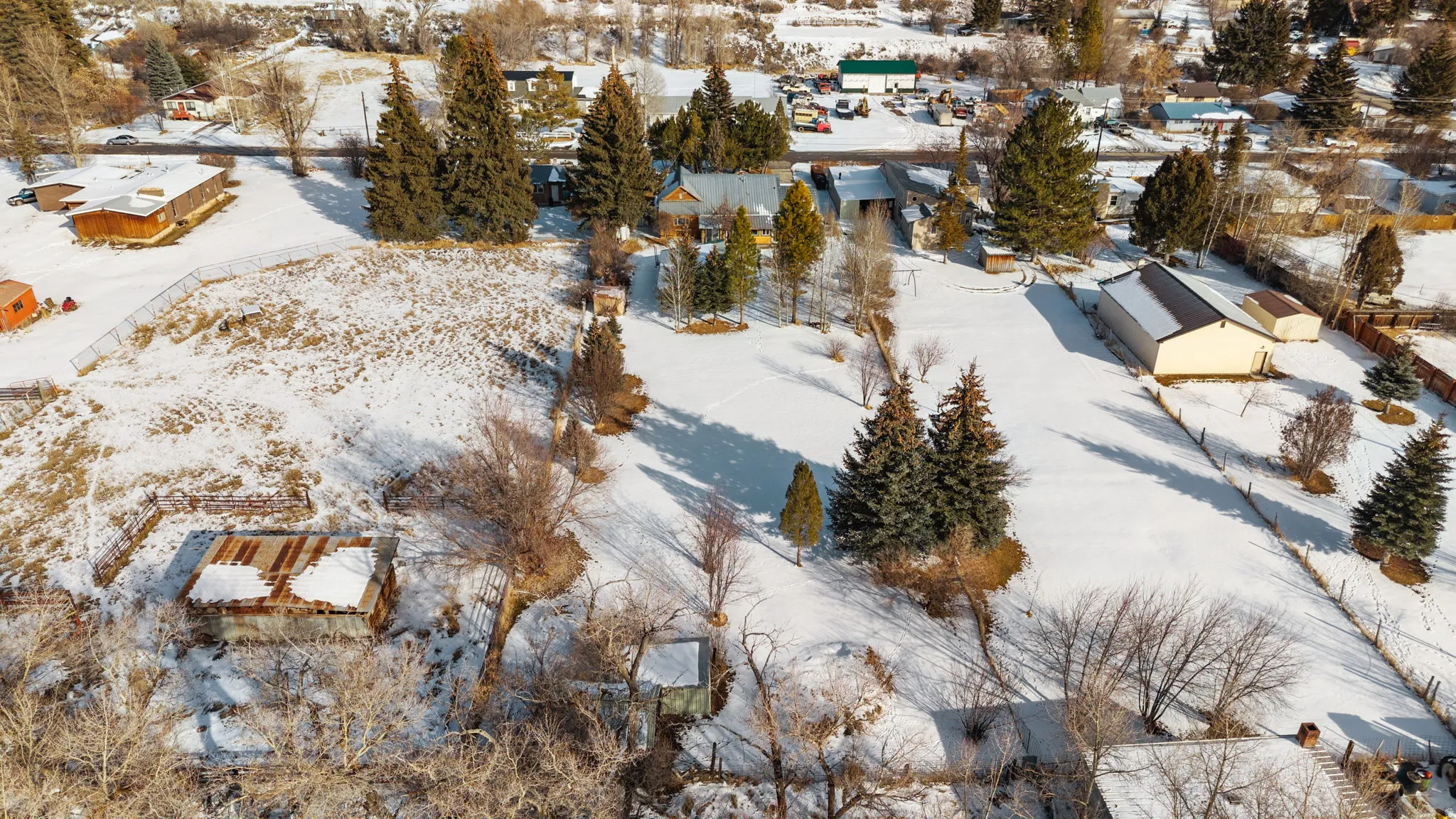 Snowy aerial view with a residential view
