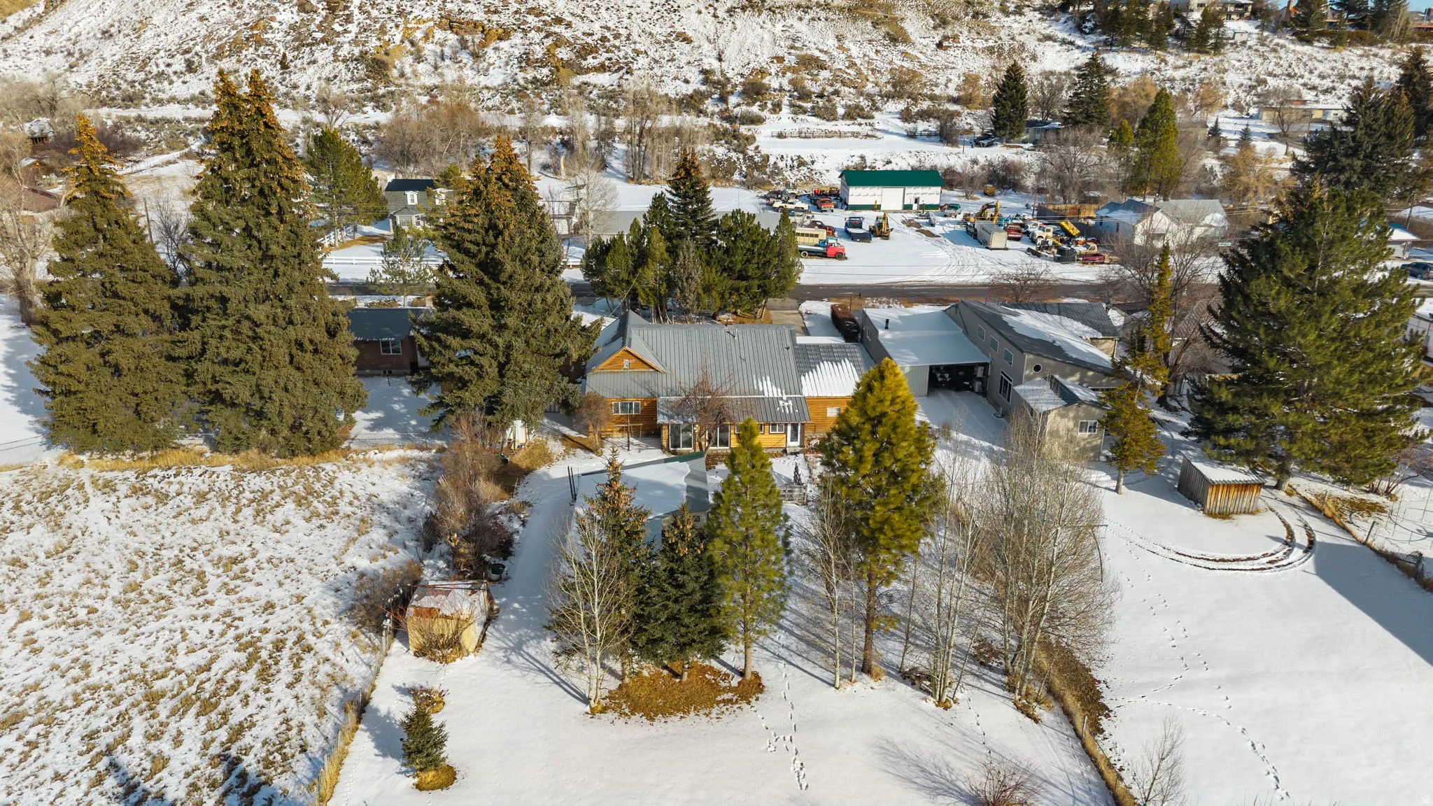 Snowy aerial view with a residential view