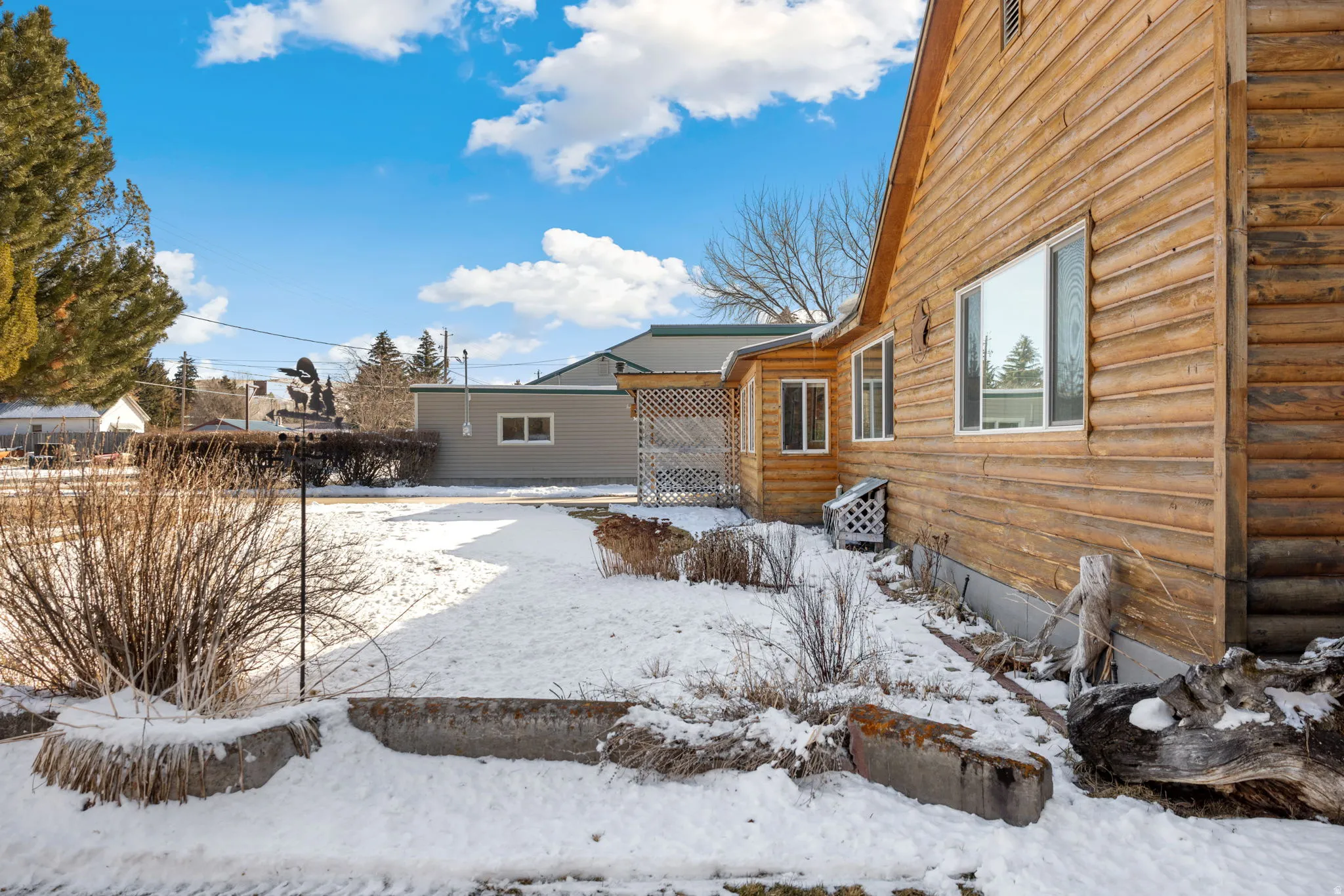 View of yard layered in snow