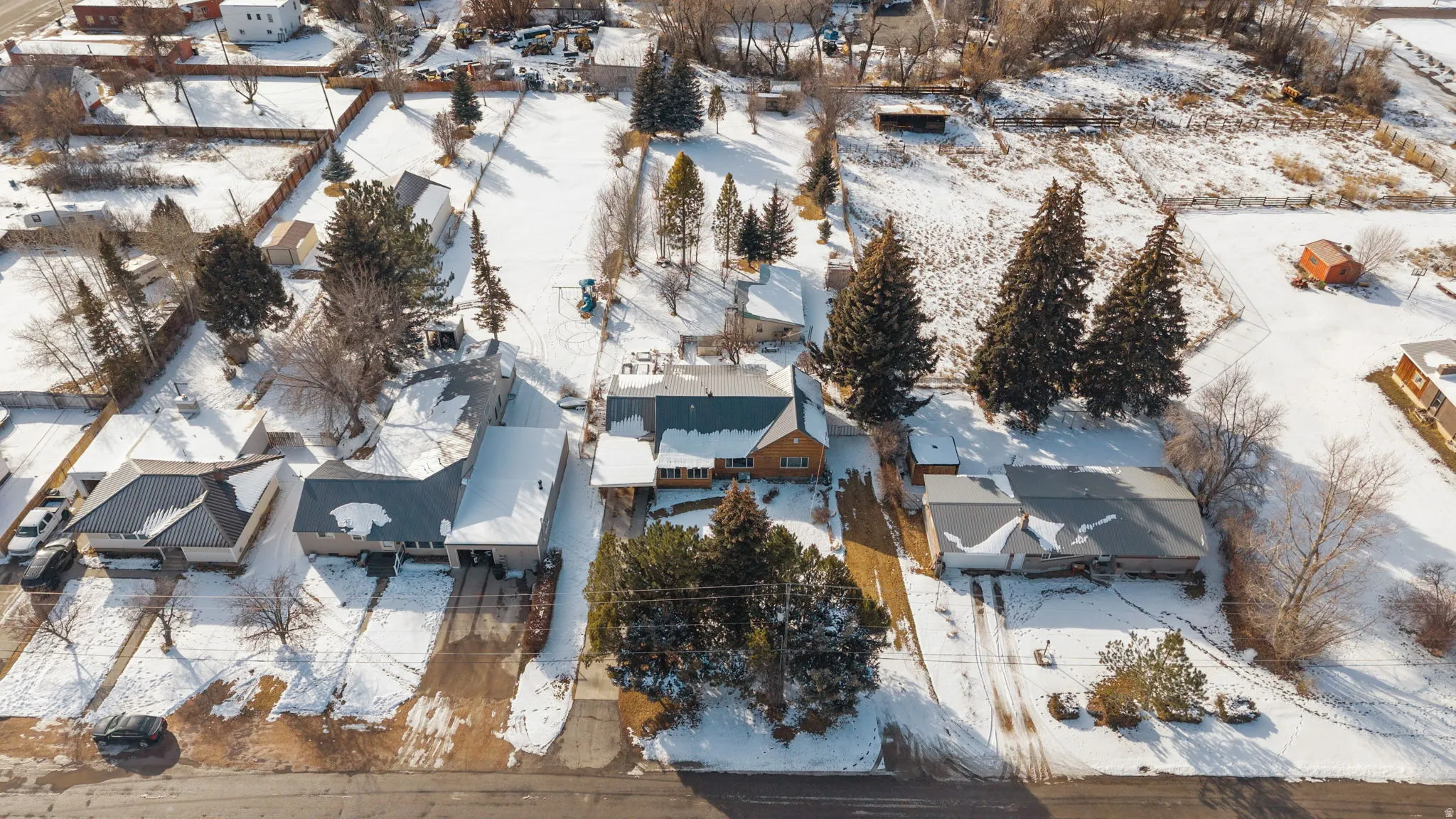 Snowy aerial view with a residential view