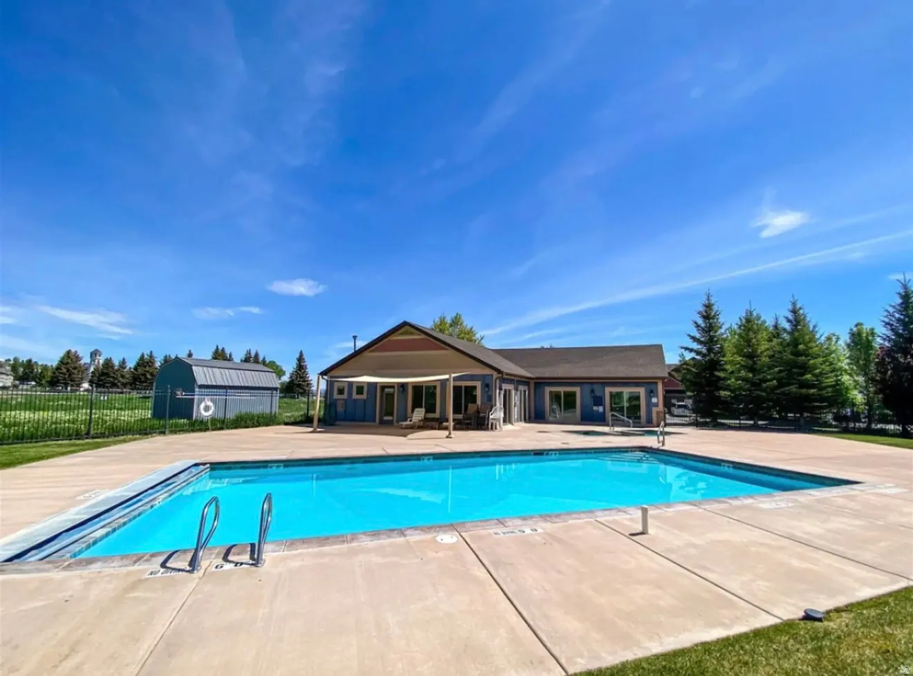 Community pool with a patio area