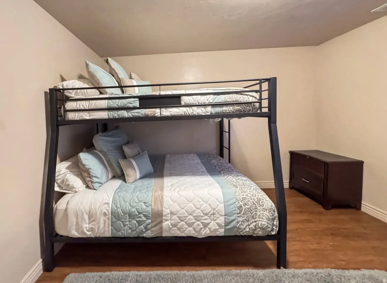 Bedroom with wood finished floors