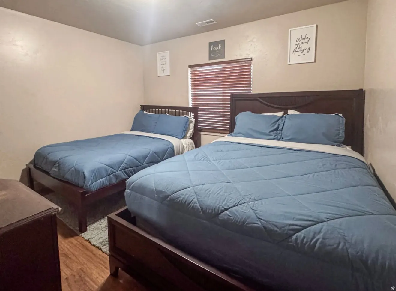 Bedroom with wood finished floors