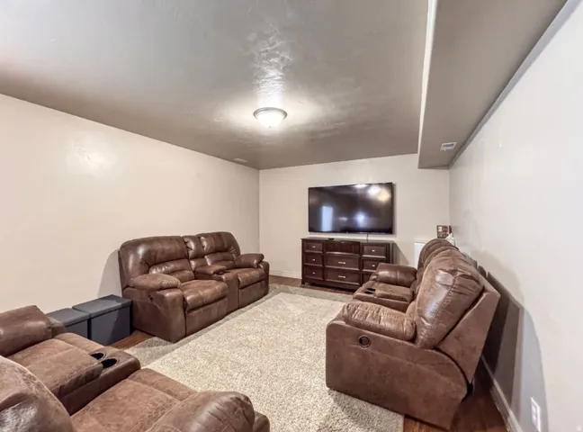 Living room with baseboards and wood finished floors