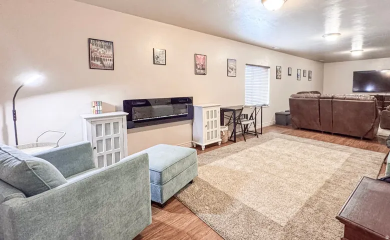 Living area featuring wood finished floors and baseboards