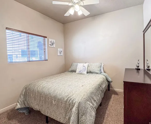 Bedroom with carpet floors and ceiling fan