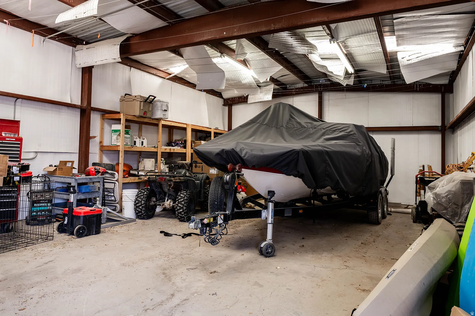 Garage featuring metal wall