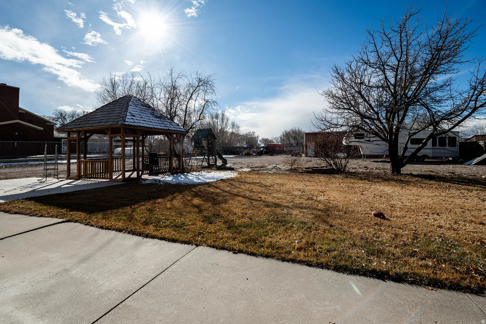 View of yard featuring a patio area and a gazebo
