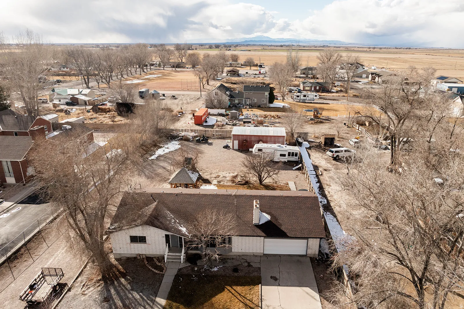 Aerial view of property's location featuring nearby suburban area