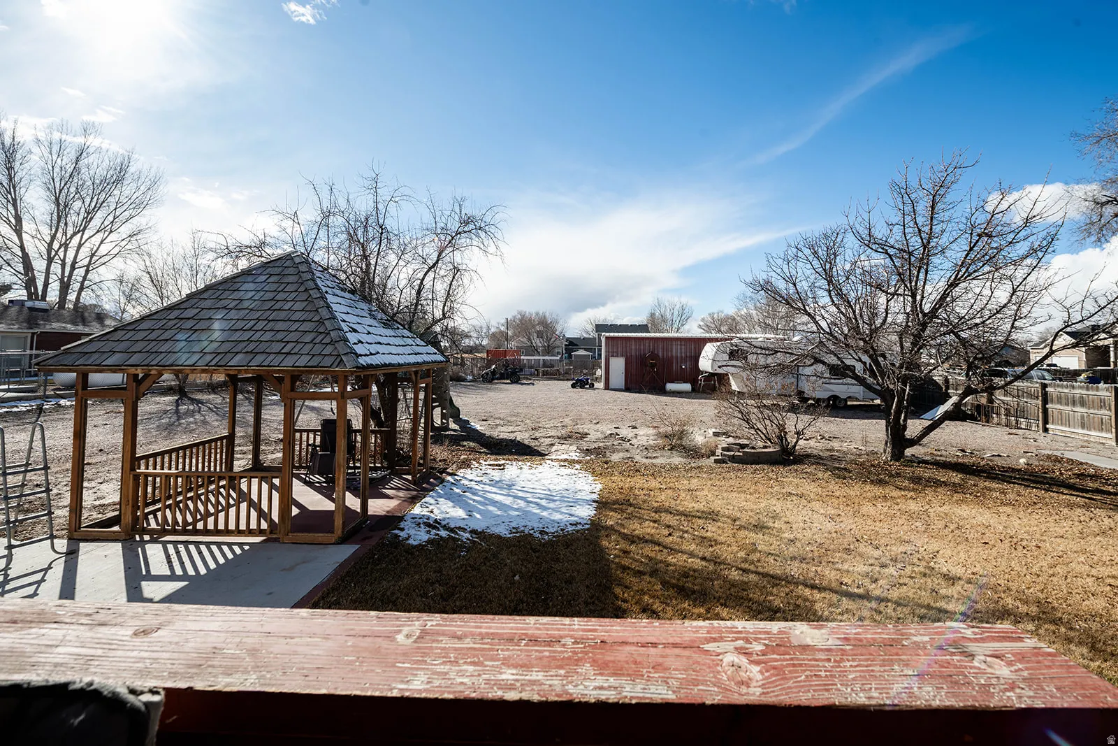 View of yard with a gazebo and a deck