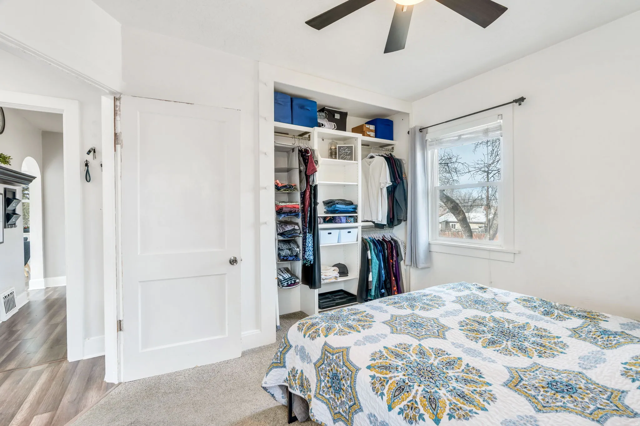 Bedroom with ceiling fan and a closet