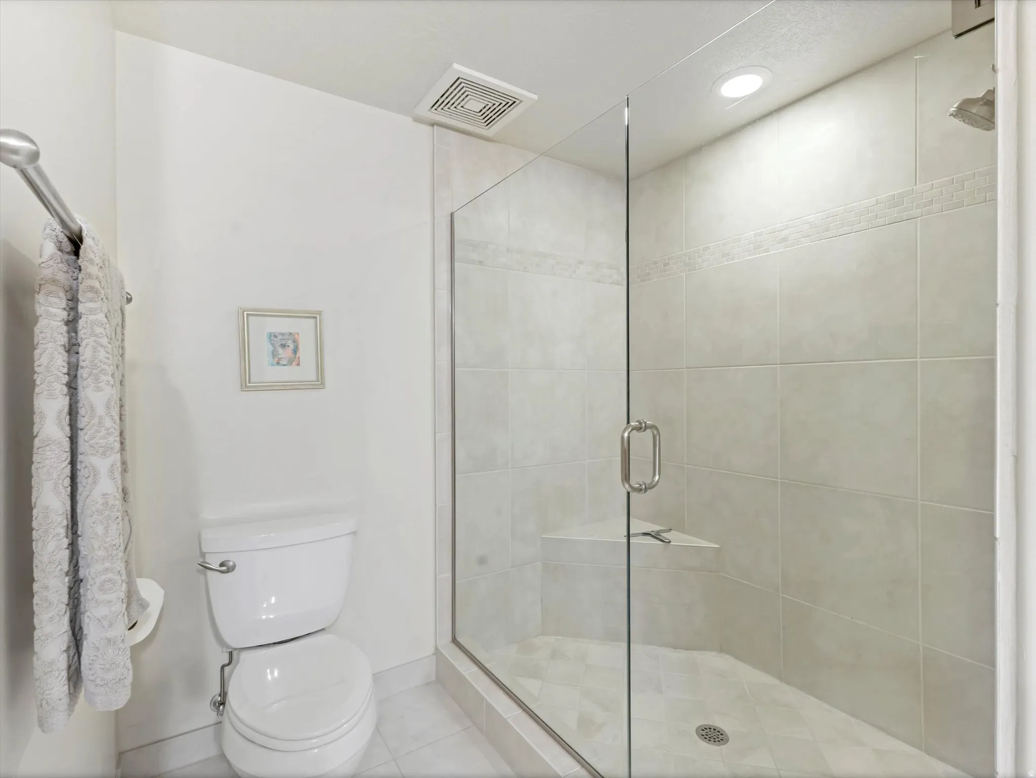 Master bathroom featuring a shower stall, european doors, recessed lighting, and tile patterned floors.