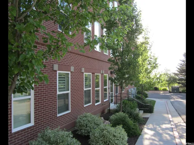 View of side of property featuring brick siding