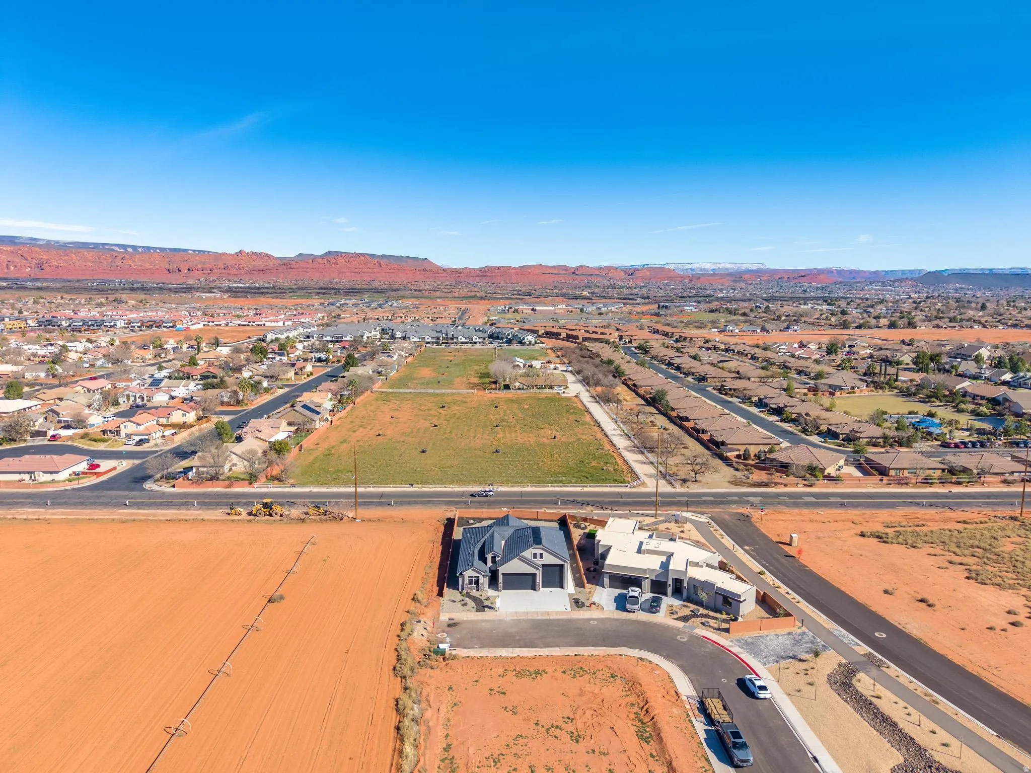 Aerial view of residential area featuring a mountainous background