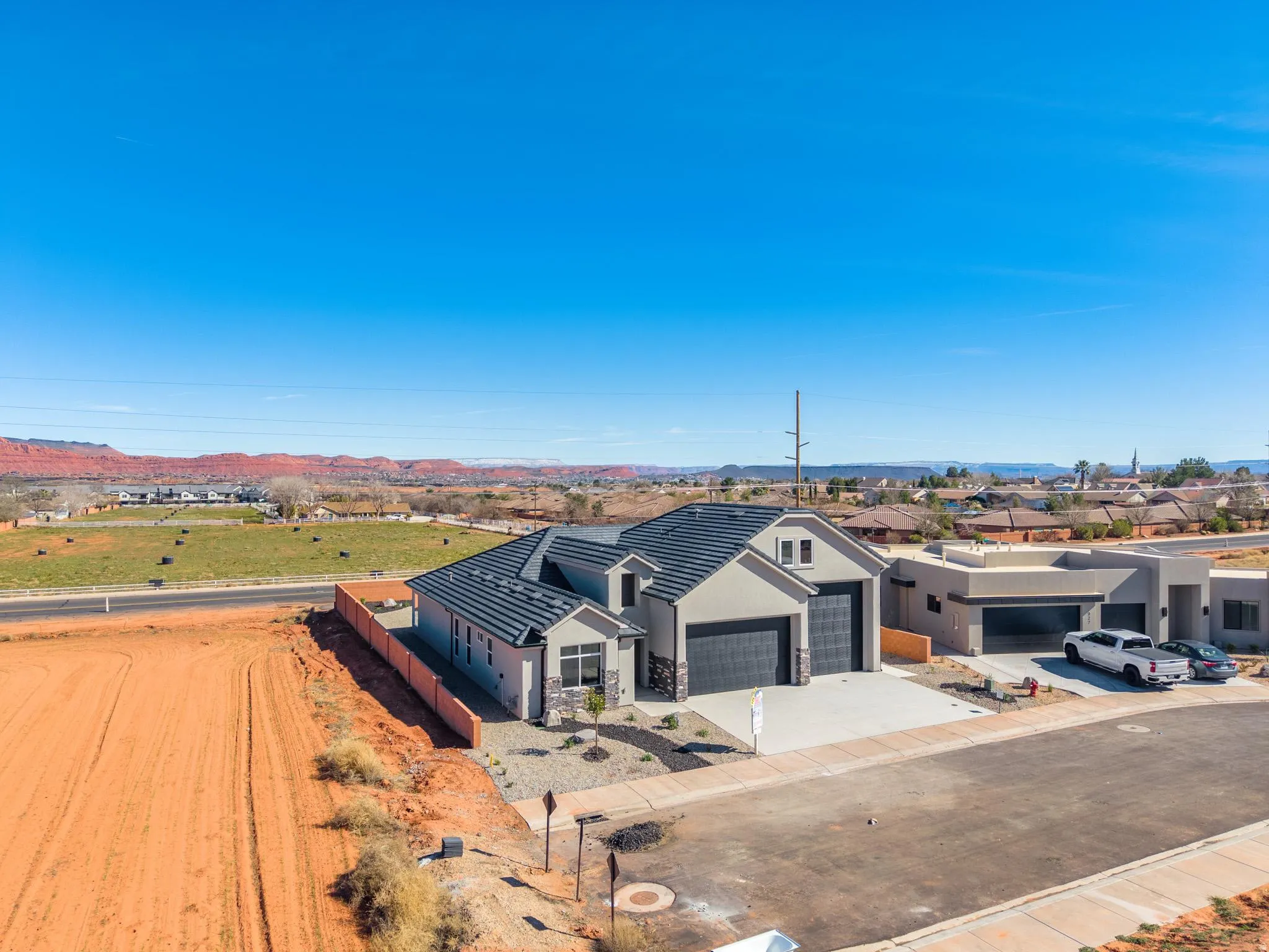 Aerial perspective of suburban area with a mountain backdrop